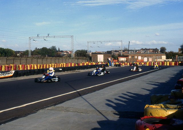 Racing karts on an outdoor circuit — the best go kart gear ratio depends on the track layout