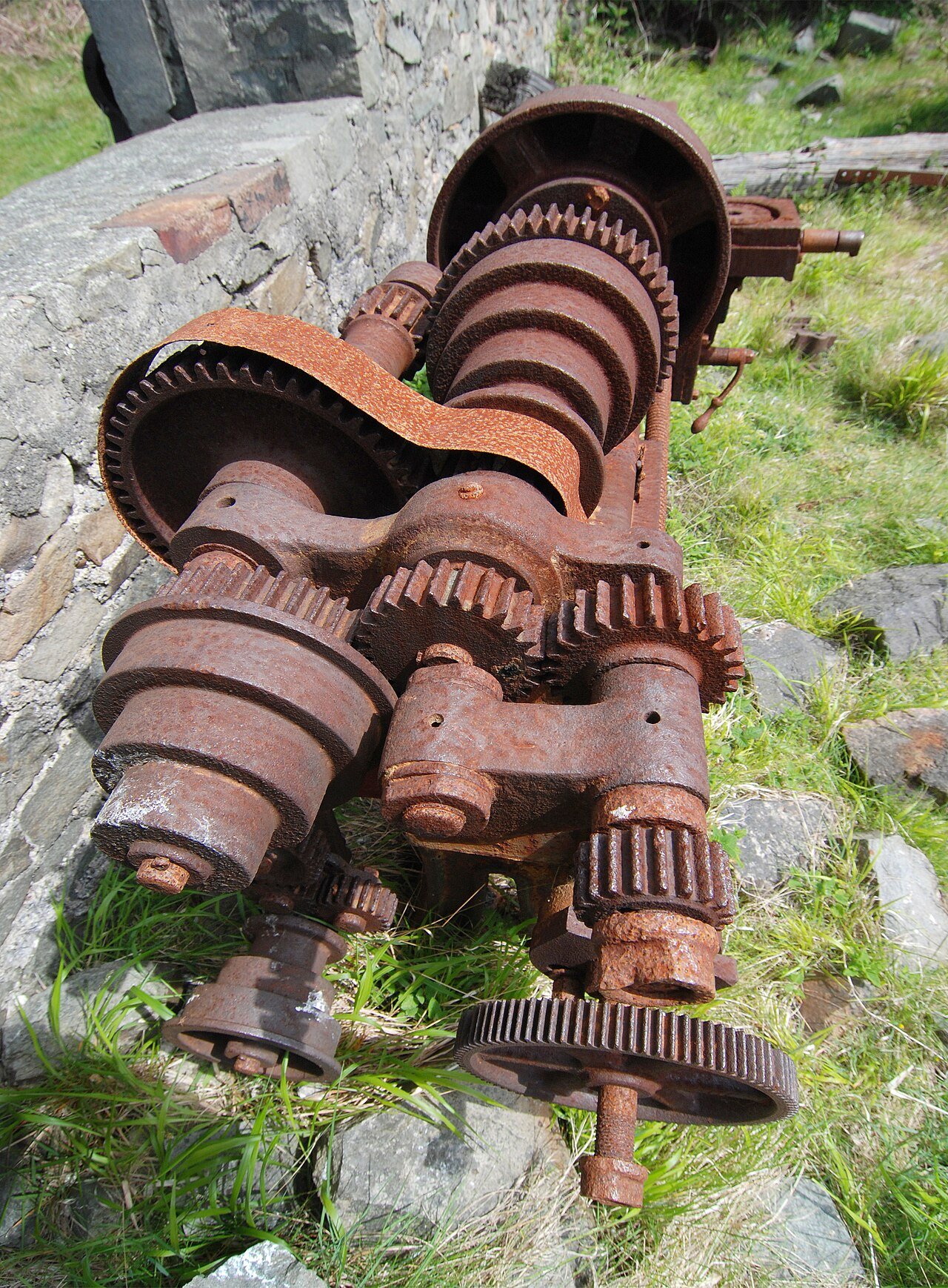 Close-up of meshing spur gears on old industrial machinery — the teeth you count to work out gear ratio