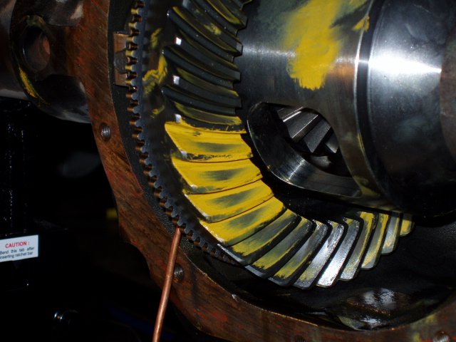 Gear marking compound on a ring gear showing the coast-side contact pattern during a professional gear setup