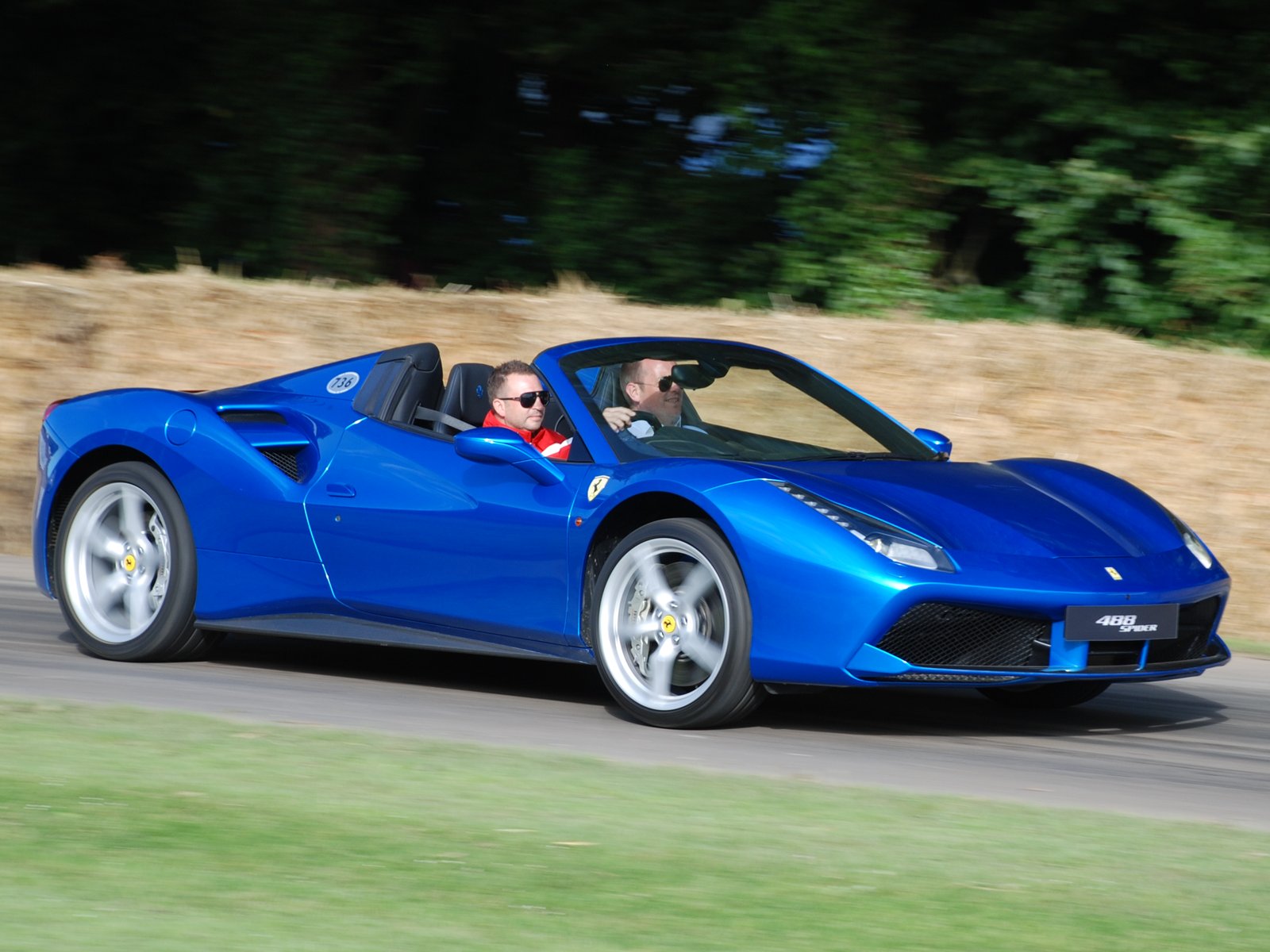 Modern sports car at highway cruise — its tallest overdrive gears keep cruise RPM low and quiet