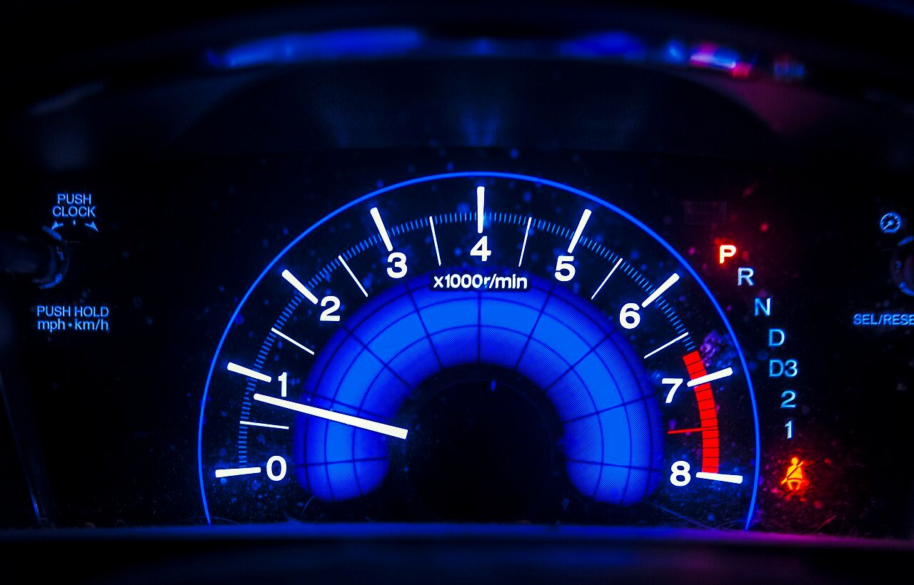 Car tachometer — the small extra RPM dip at cruise reveals what is overdrive lockup engagement